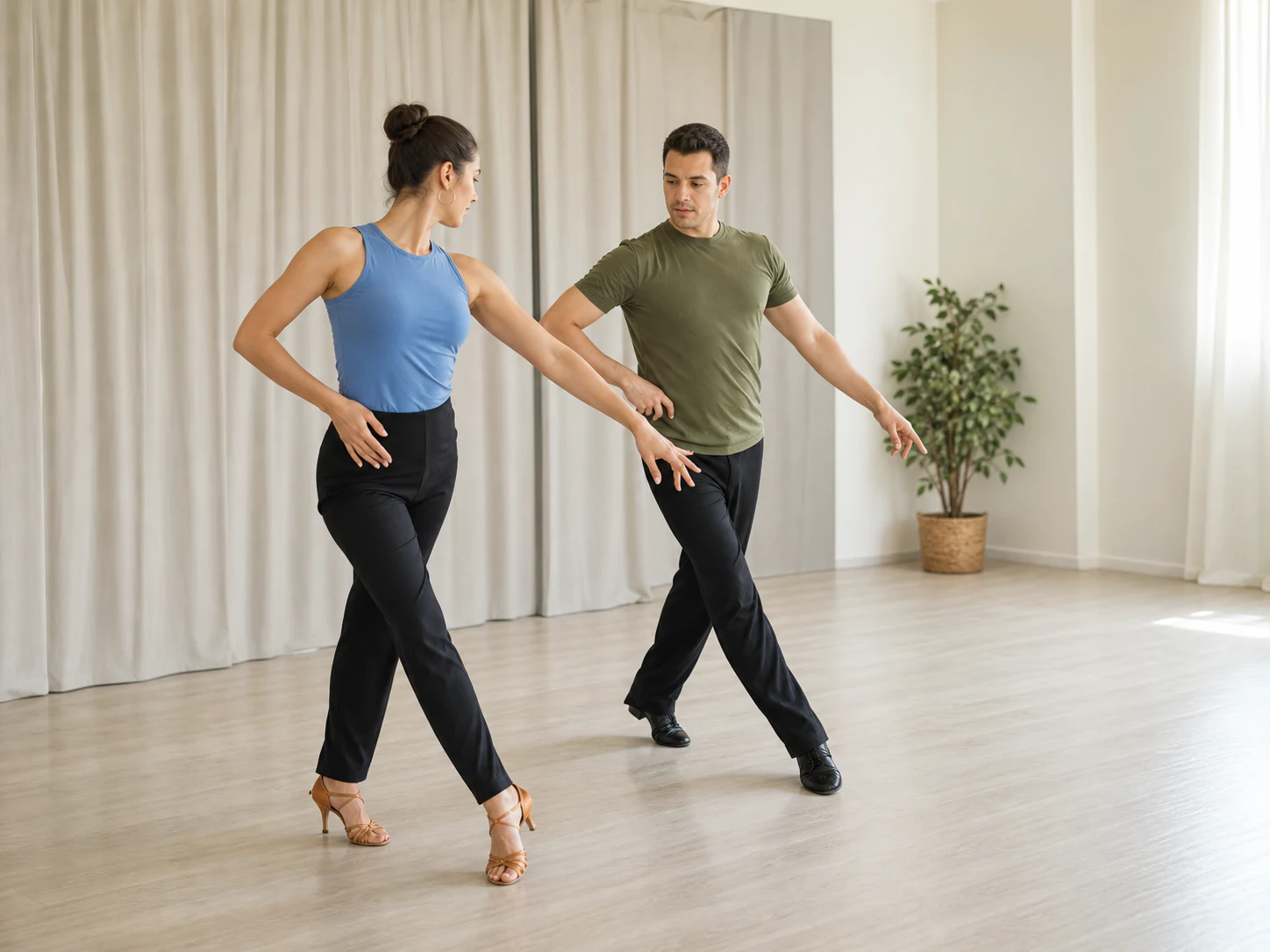 Partners practicing Latin crossover patterns in a bright studio